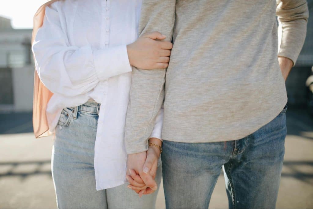 A man and woman holding each other