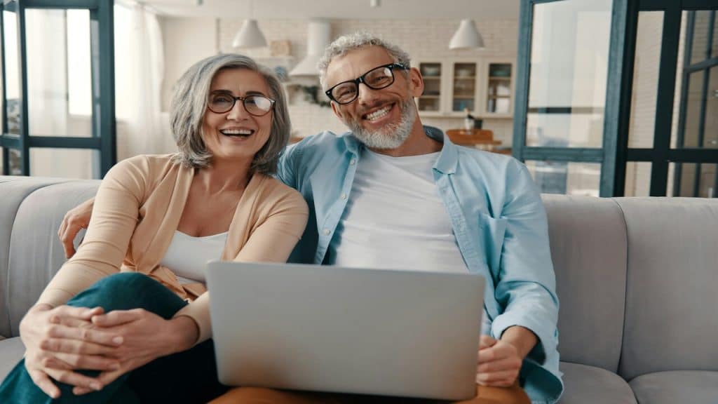 A couple smiling at the camera while bonding