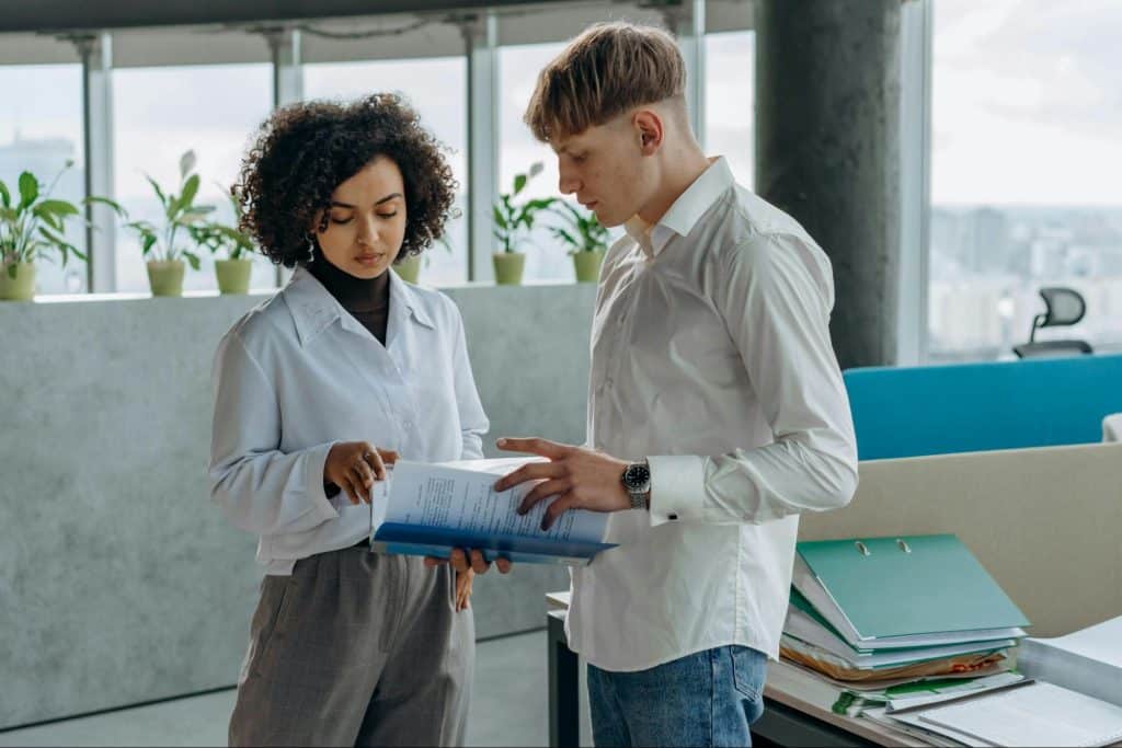 A man and woman working together on something