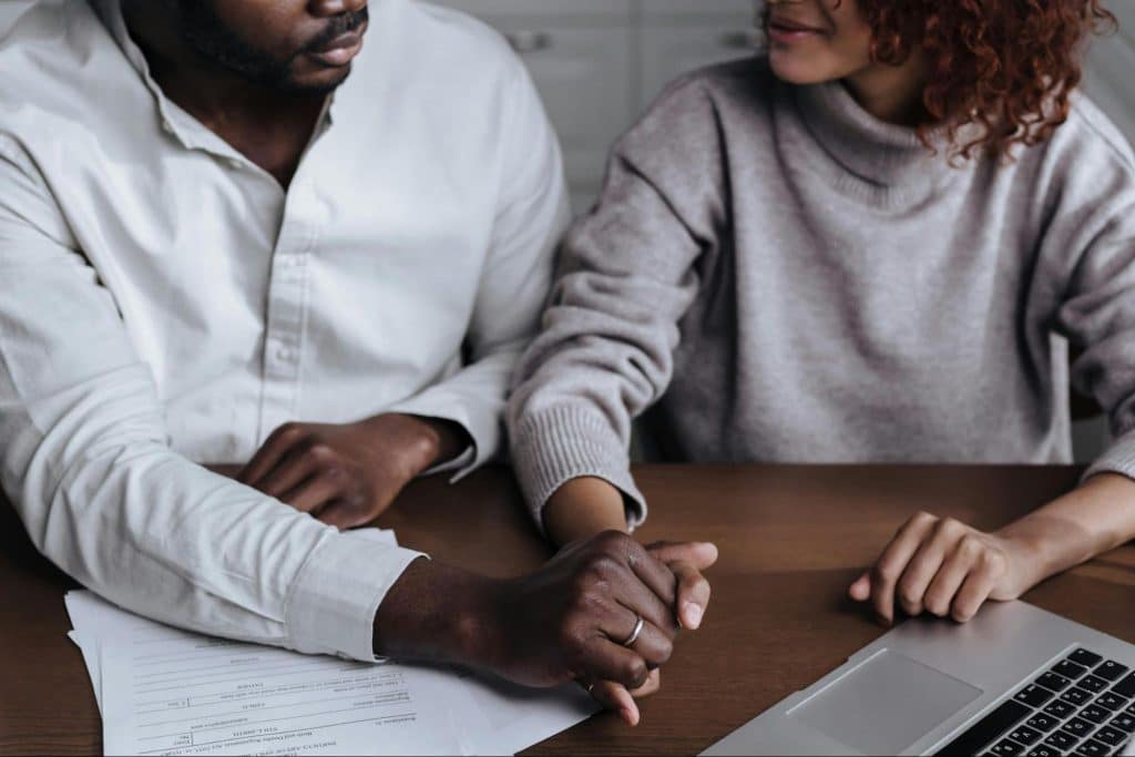 A man and woman holding hands