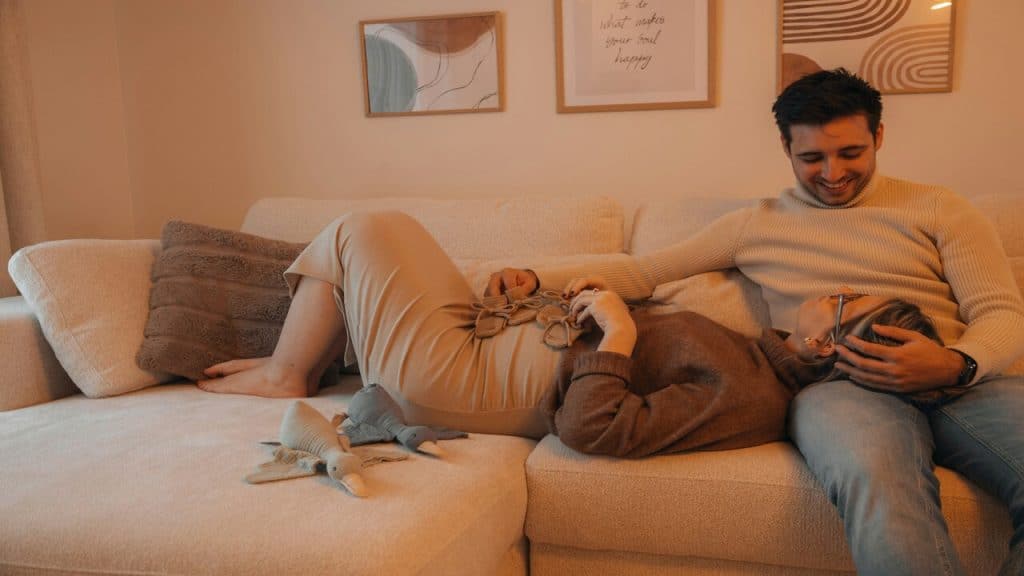 A couple talking on the couch