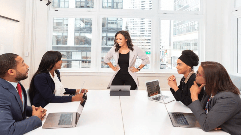 People smiling at each other at a meeting