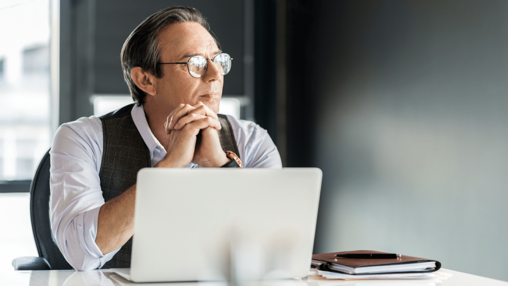 A calm businessman looking out the window
