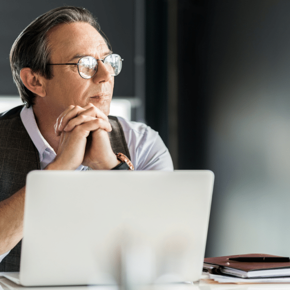 A calm businessman looking out the window