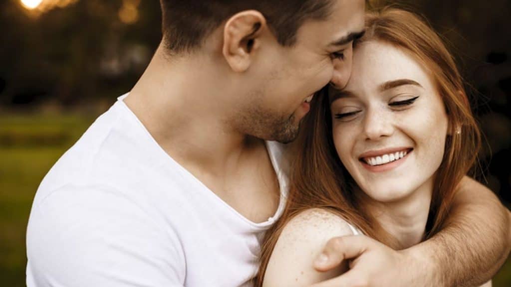 Couple hugging warmly after a calm conversation