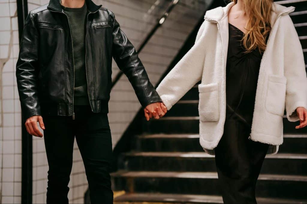 A man and woman holding hands 
