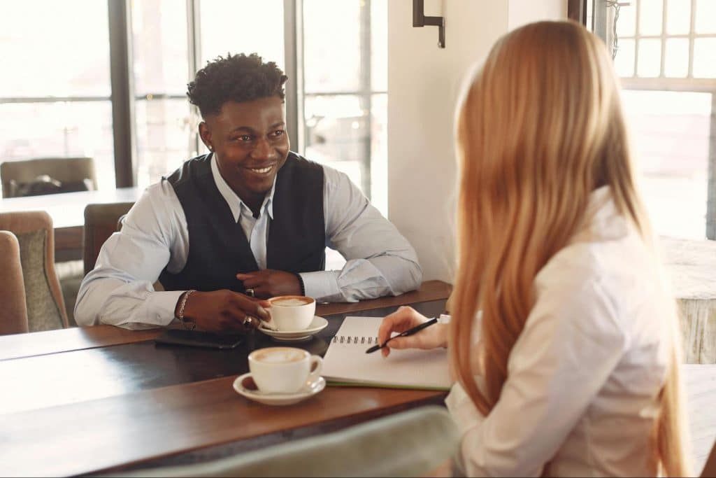 A man and woman talking 