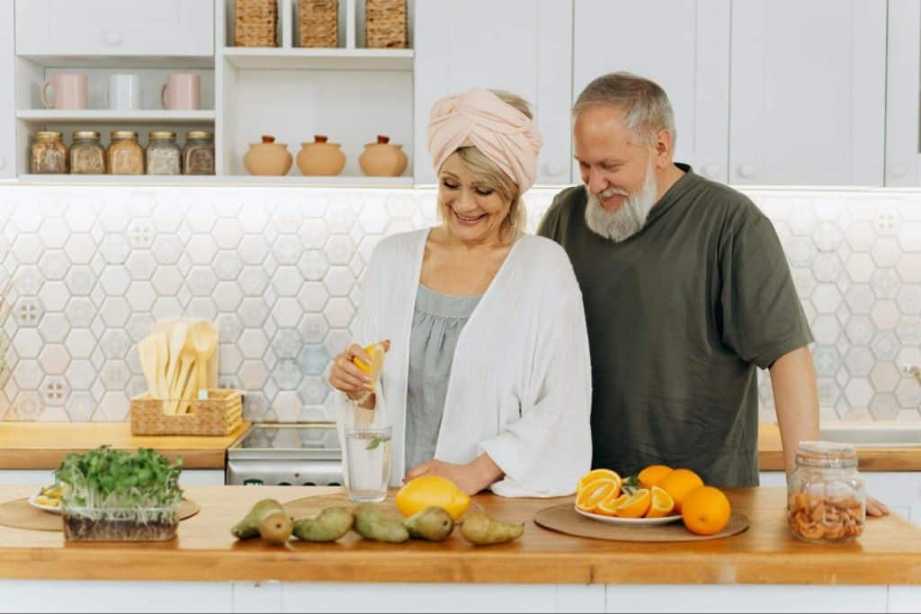 A man and woman at the kitchen