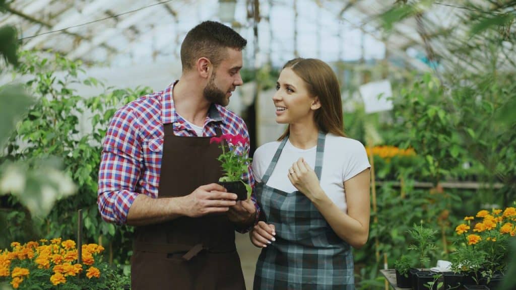 A couple in a greenhouse