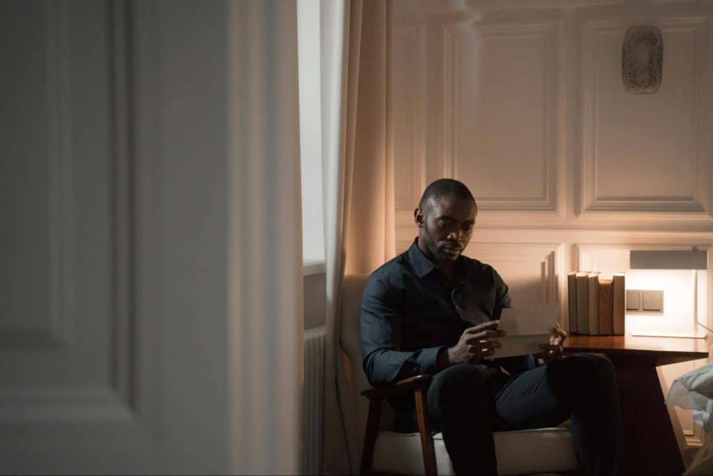 A man reading a letter
