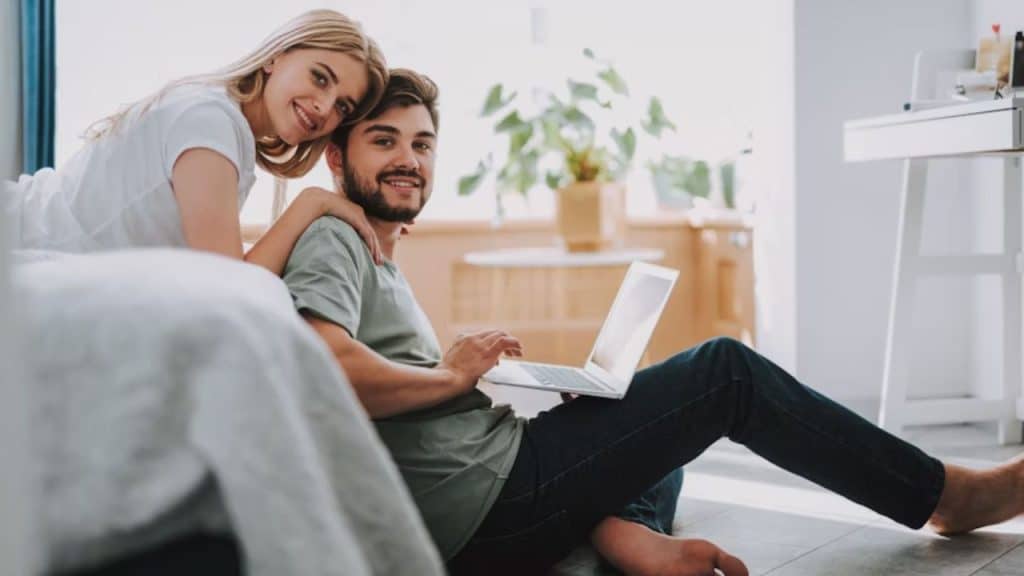 Man on laptop late while wife waits in bed