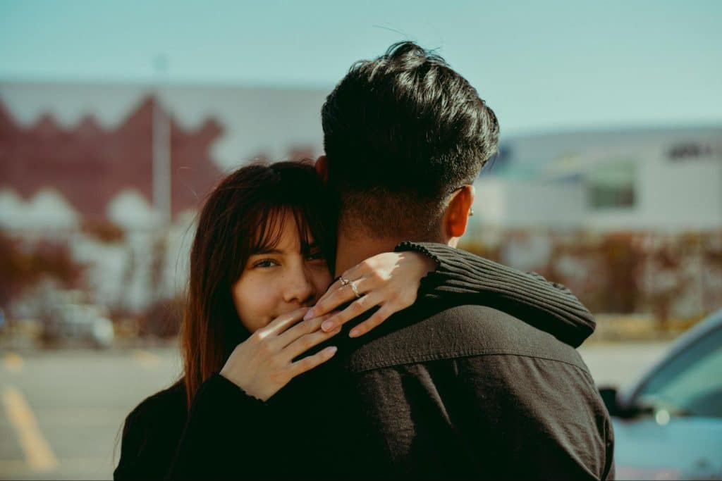 A man and woman hugging