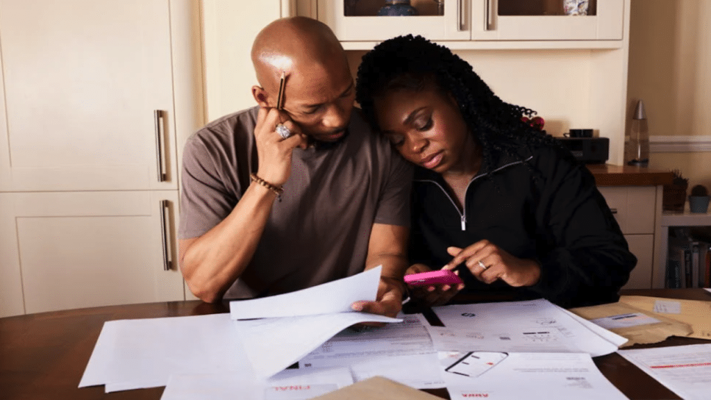 A couple calculating their expenses