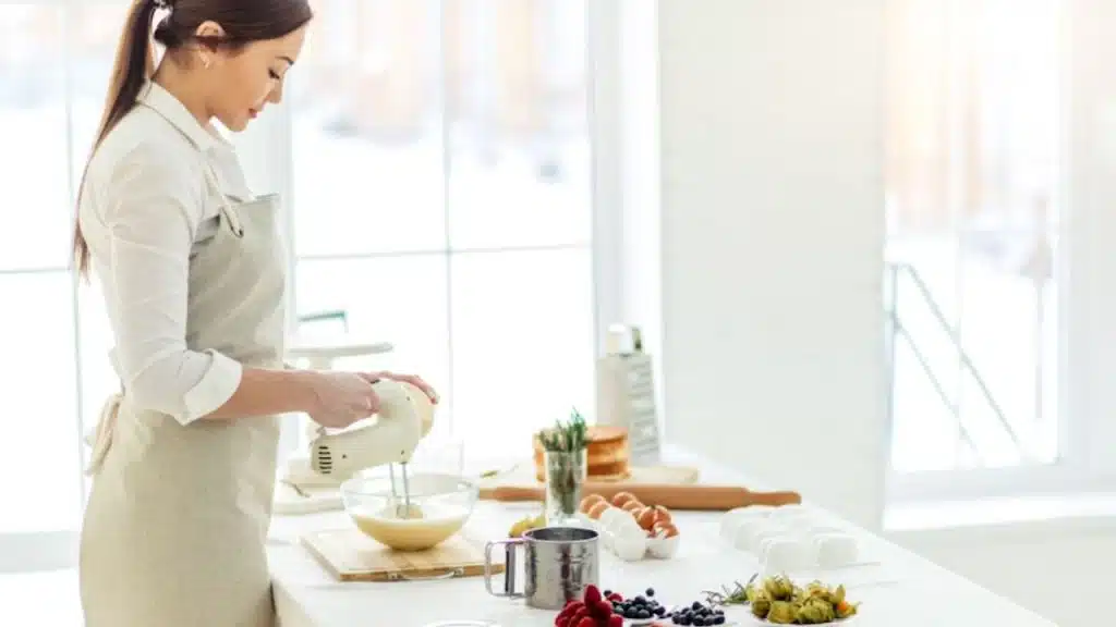 Woman preparing breakfast while forcing a polite smile