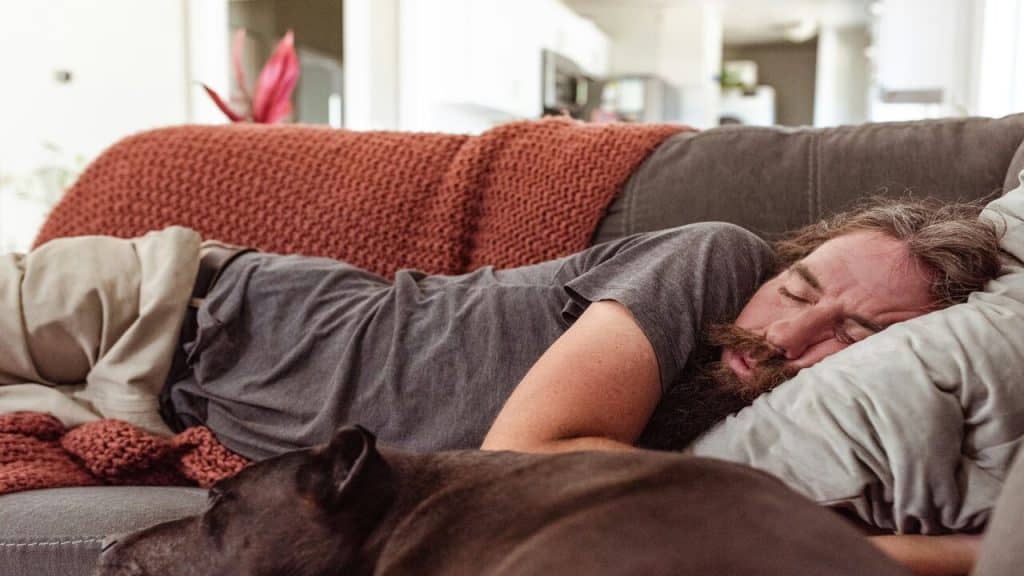 A man sleeping on the couch