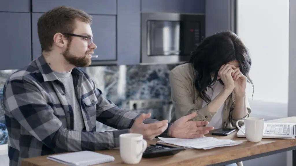 A woman crying while her husband talks