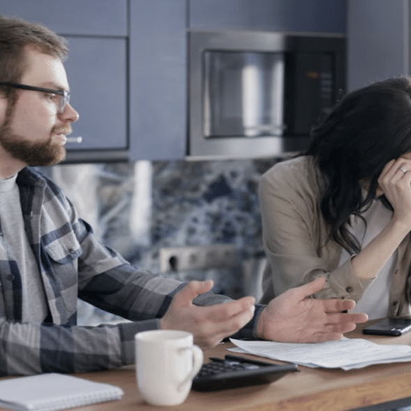 A woman crying while her husband talks