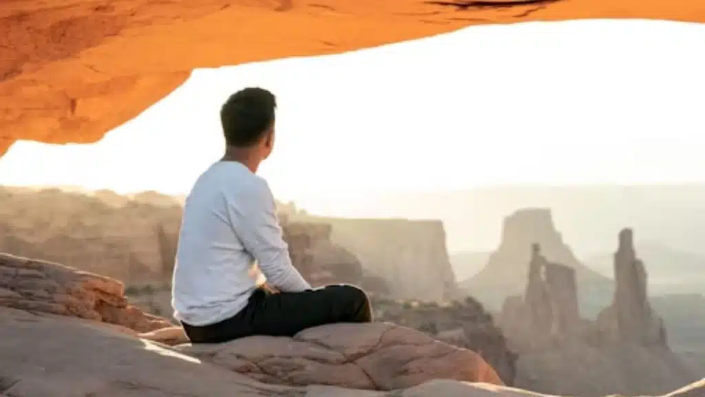Man achieving clarity through early morning meditation outdoors
