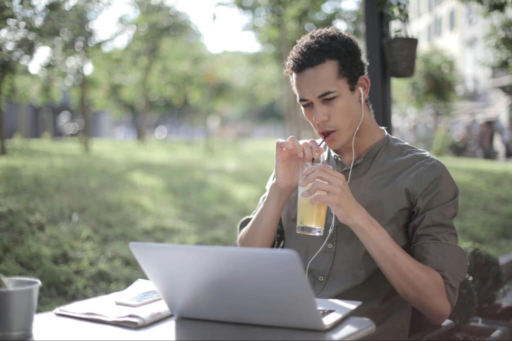 A man looking at the laptop 