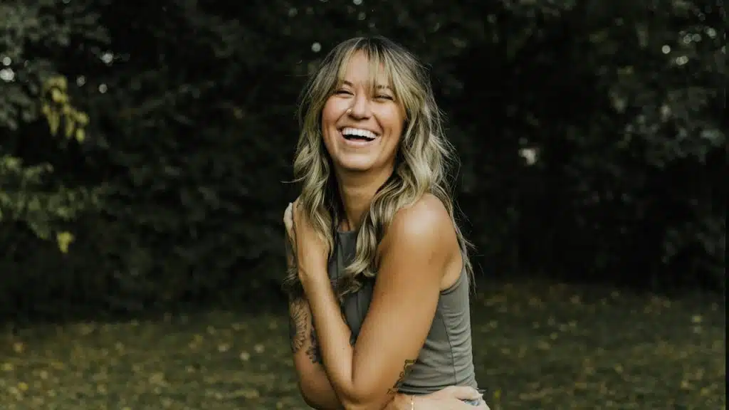 A woman laughing.
