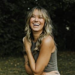 A woman laughing.