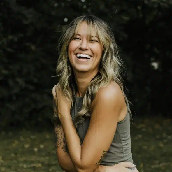 A woman laughing.