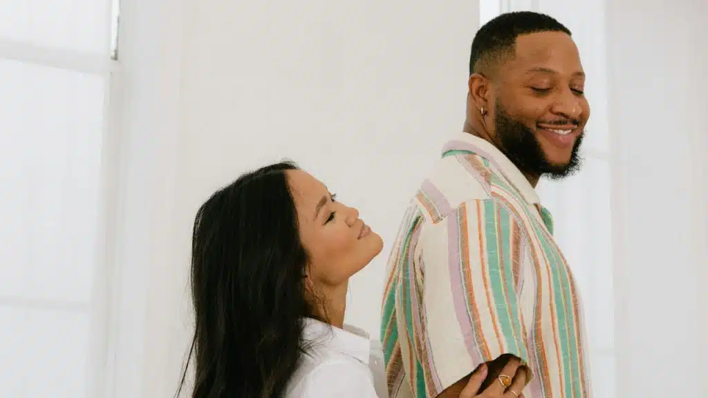 A man and a woman smiling together. 