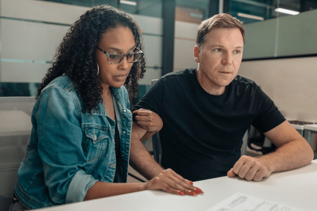 Man and woman signing a paper