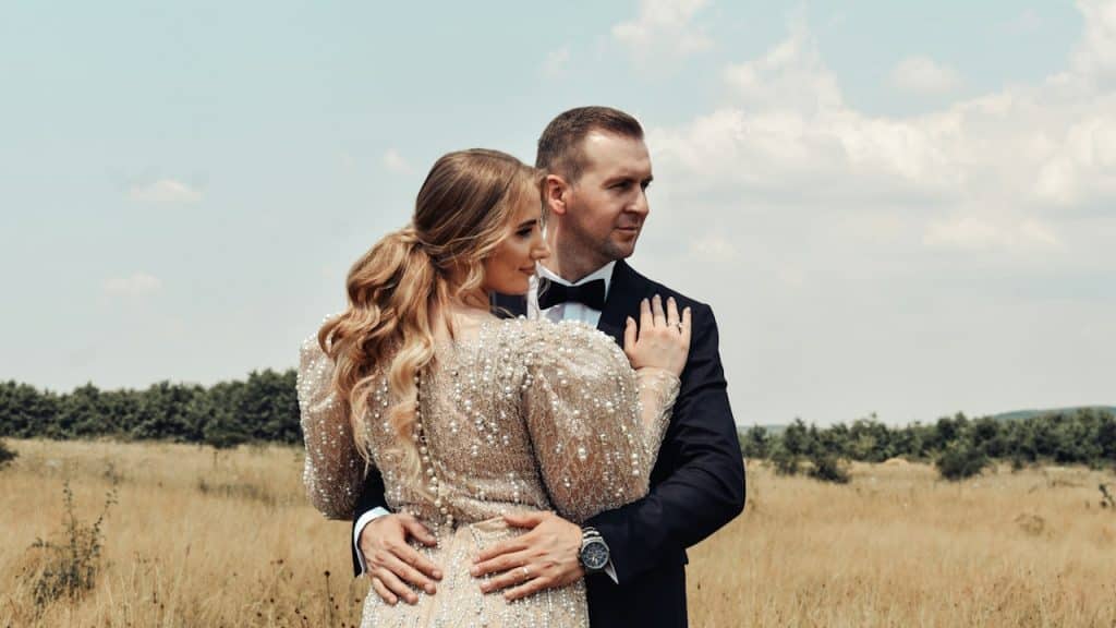 A man and a woman hugging each other.