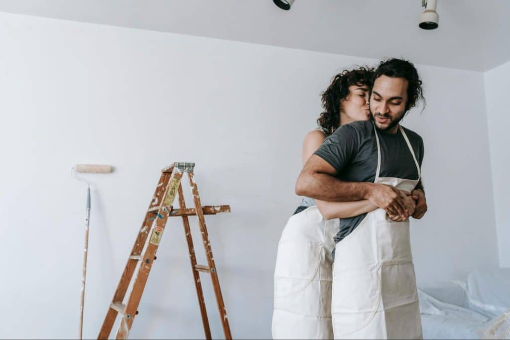 A woman hugging a man from behind