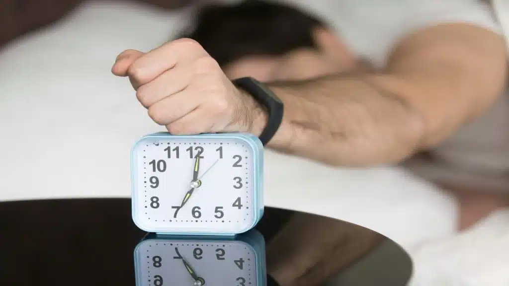 A man waking up at 7 am