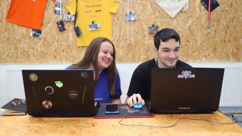 Couple collaboratively working on their laptops together