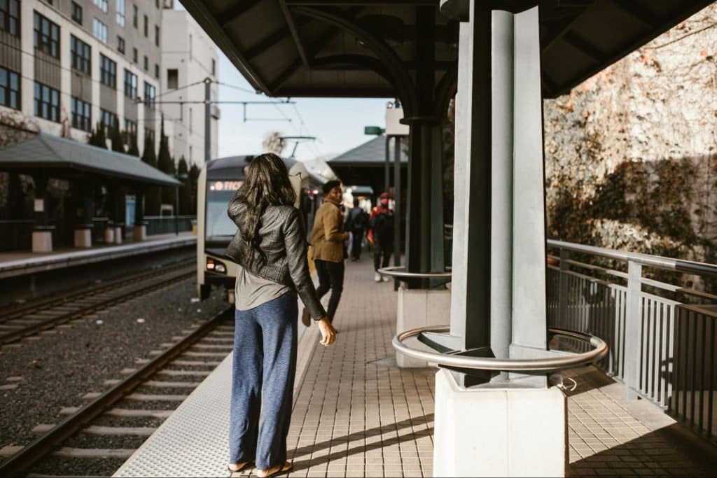 A man and woman at the train station 