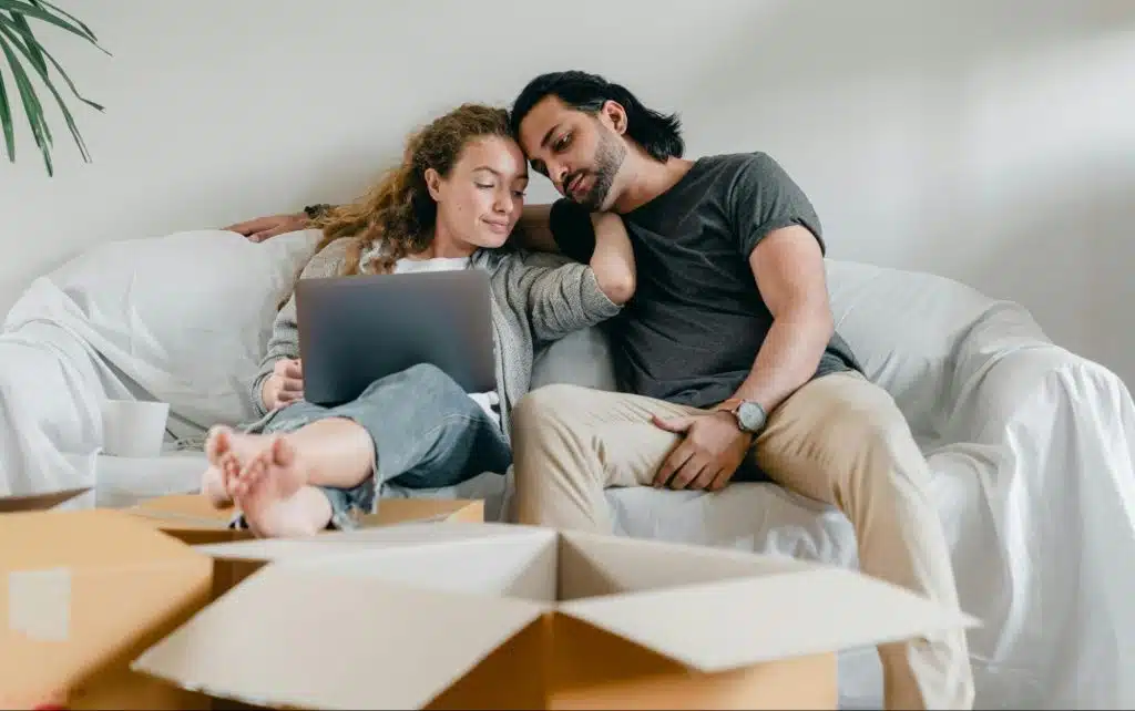 A man and woman sitting at the sofa 