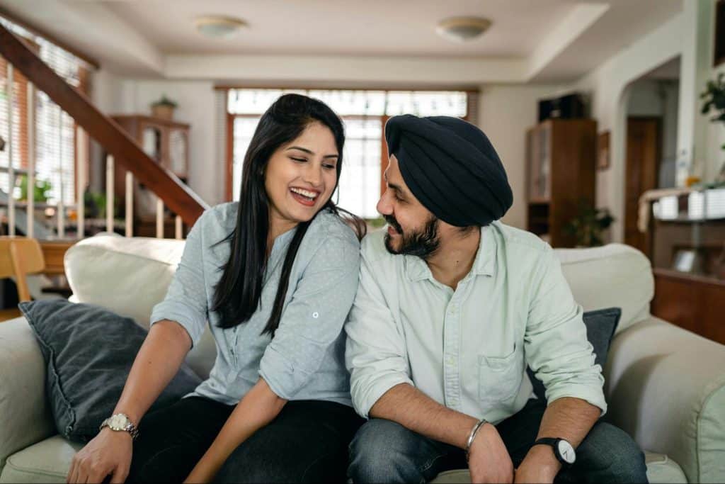 A man and woman smiling at each other