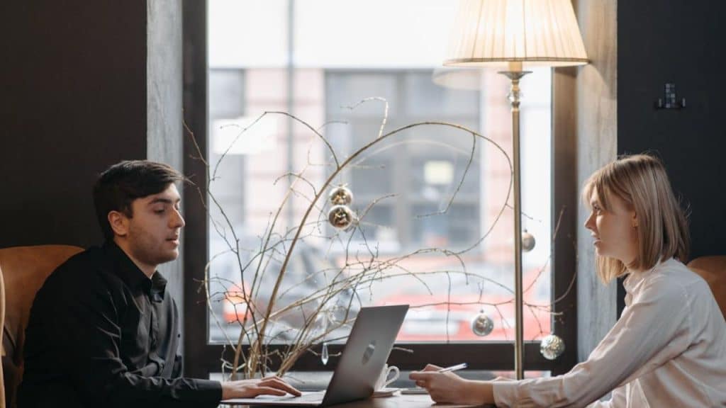 Man avoiding eye contact during a tense conversation with his partner