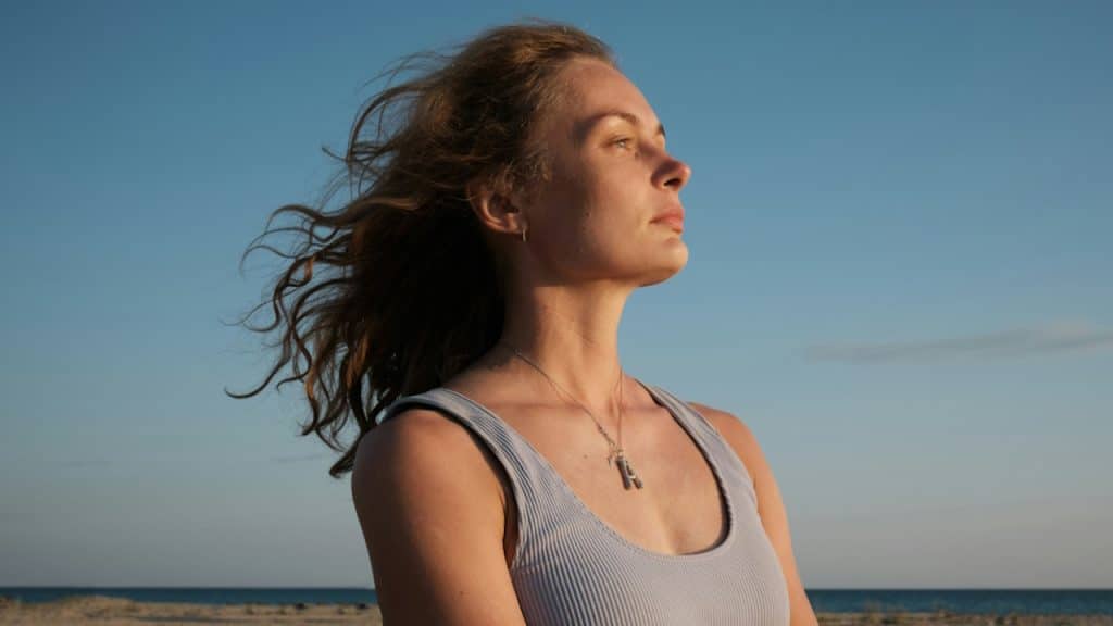 A pensive woman at the beach.