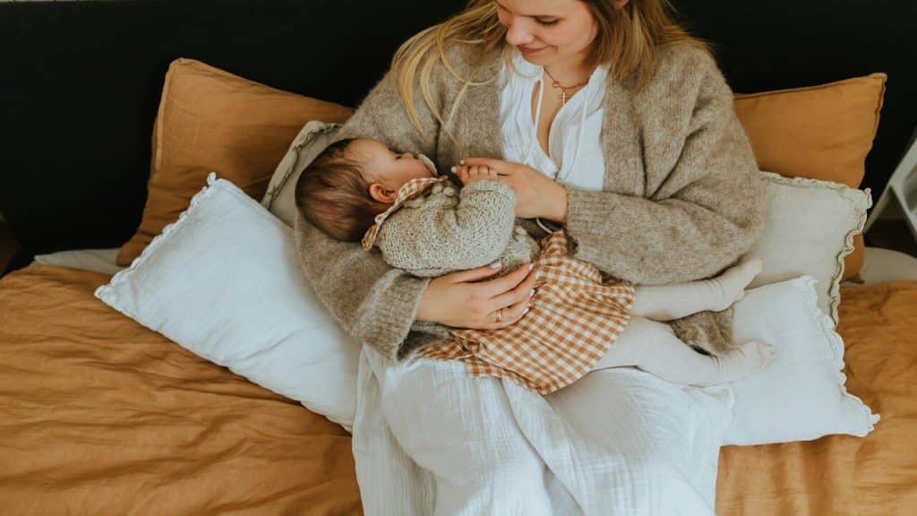 A mom holding her baby 