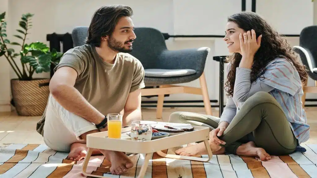 A couple talking during breakfast
