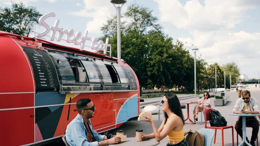 A couple having a date at an outdoor cafe.