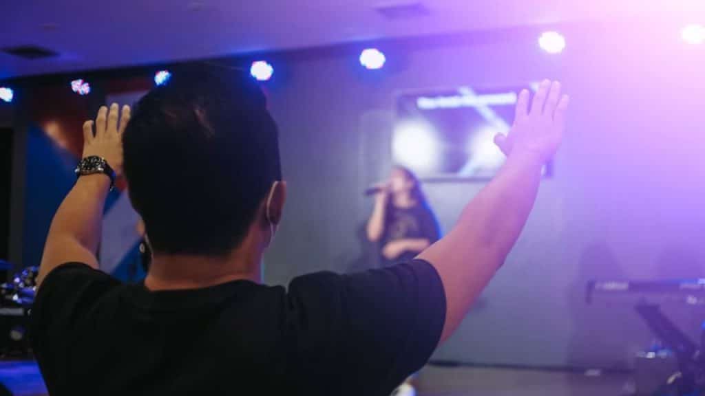 Man cheering for his partner at a local event