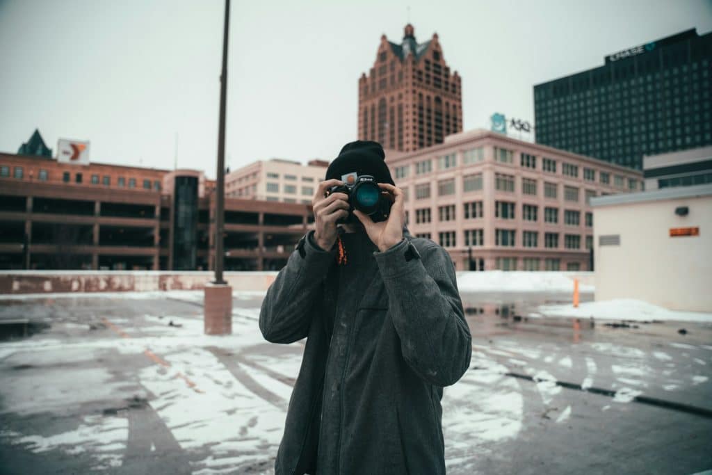 The man is holding his camera.