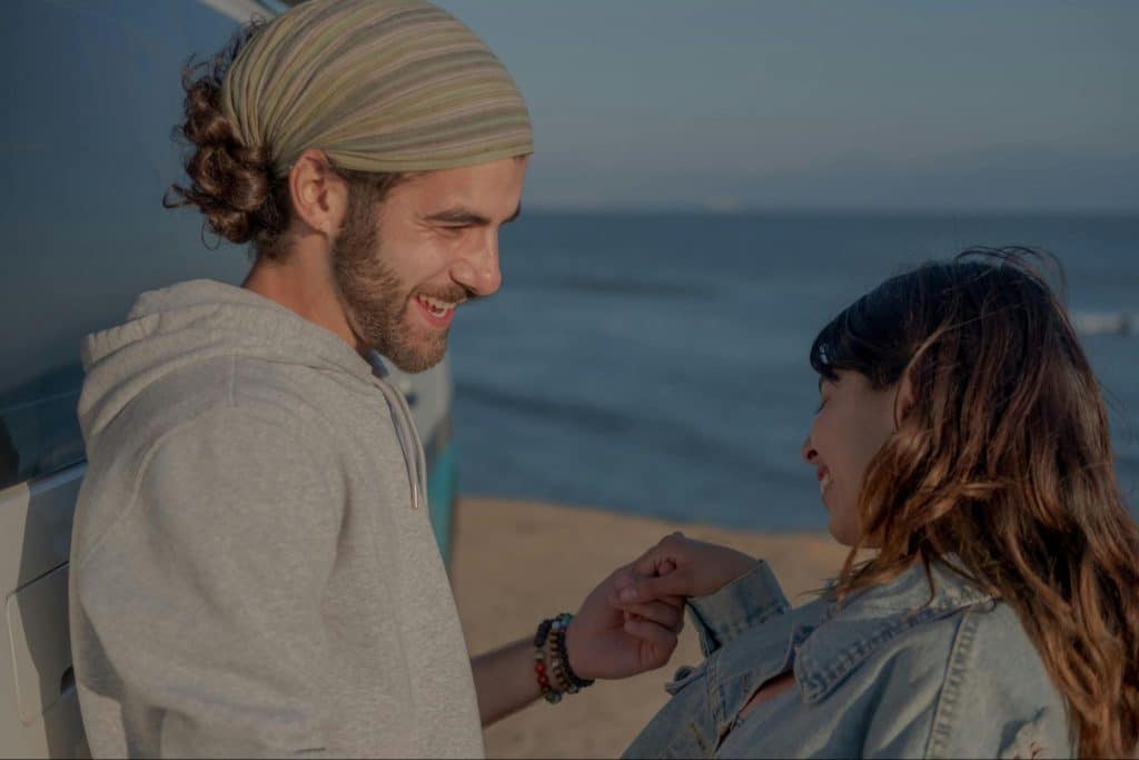 A man and woman holding hands