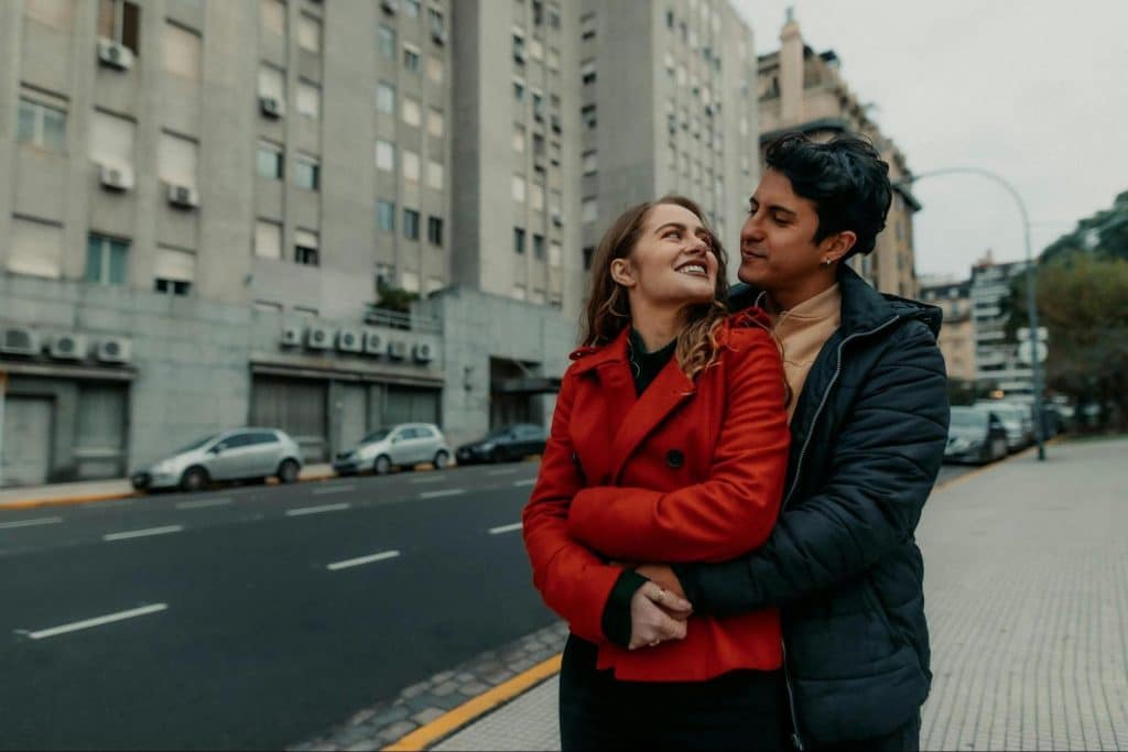 A man hugging a woman