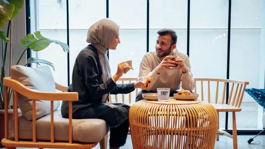 A couple talking on a date and having tea.