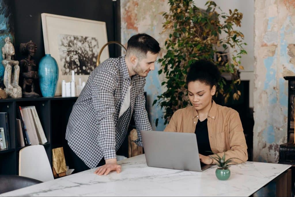 A man looking at the working woman
