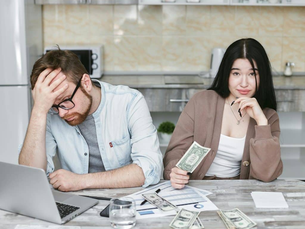 The man and the woman are doing their budget.