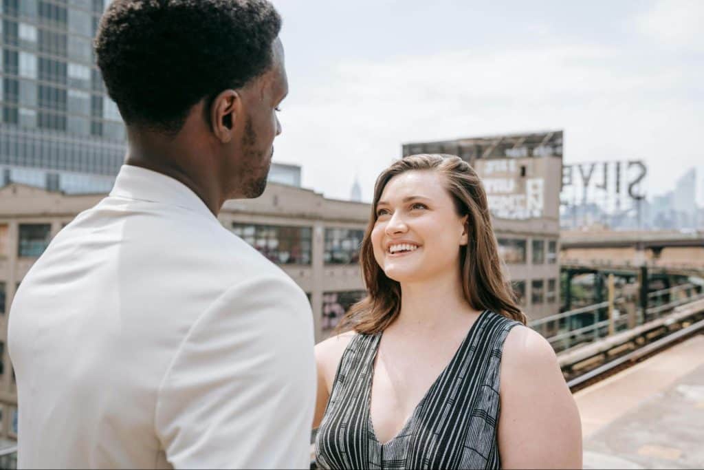 A man and woman smiling at each other