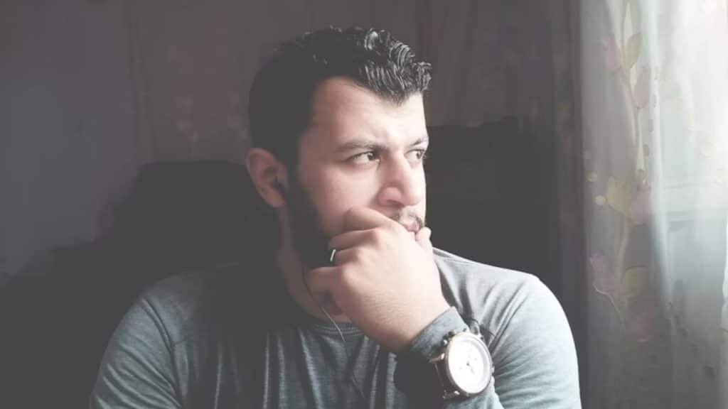 Husband looking thoughtful while sitting quietly at home