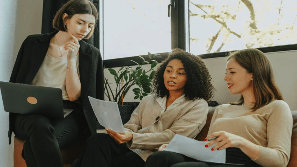 A woman looking at her colleagues’ work